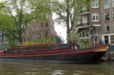 House boat topped with a flower garden